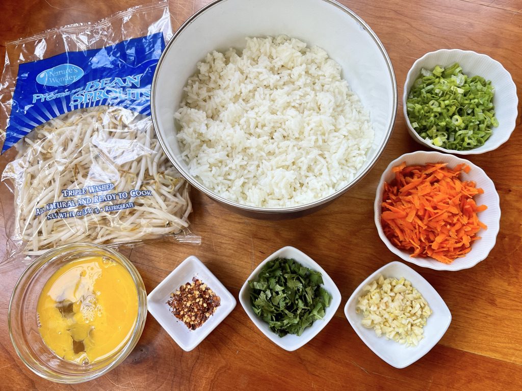 Ingredients for the Vietnamese Fried Rice - scallions, carrots, bean sprouts, eggs, white rice, garlic, red pepper flakes, and cilantro/mint