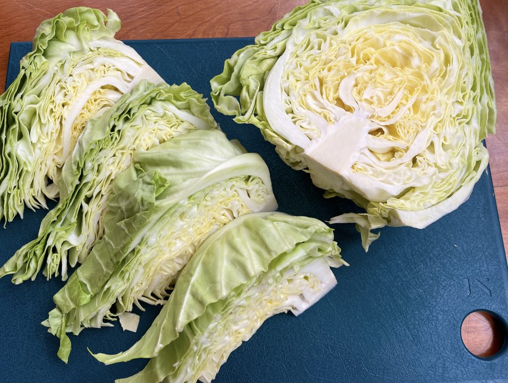 cut cabbage in half, and then cut each half into 4 wedges for a total of 8 wedges