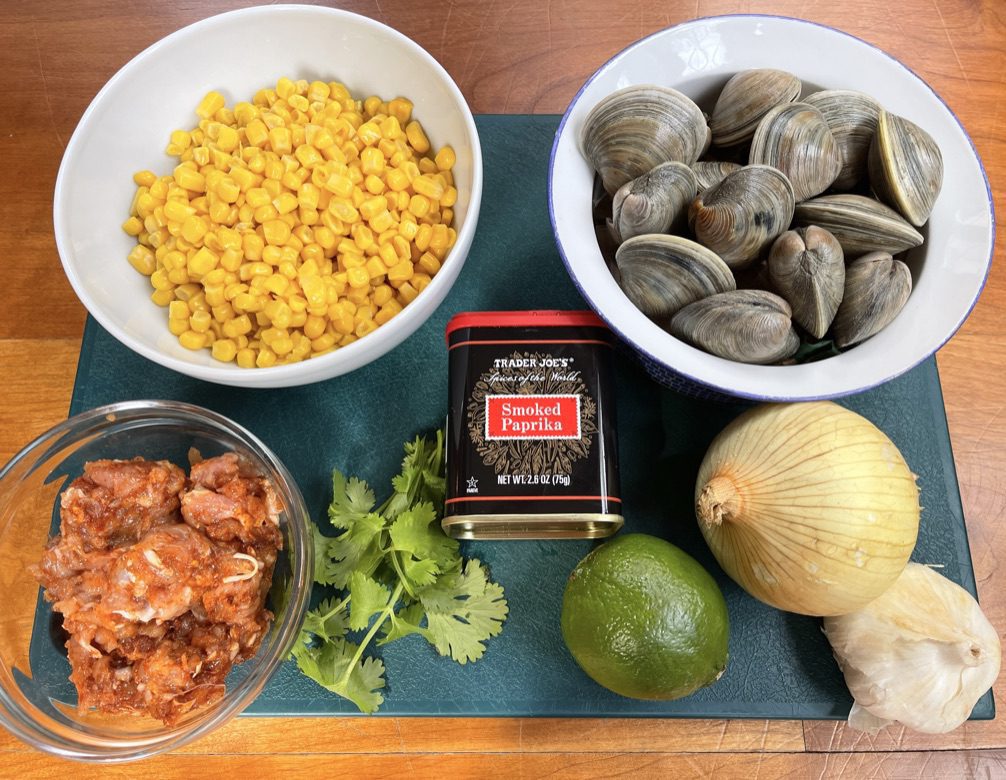 chowder ingredients- corn, clams, chorizo, smoked paprika, onion, garlic, lime and cilantro