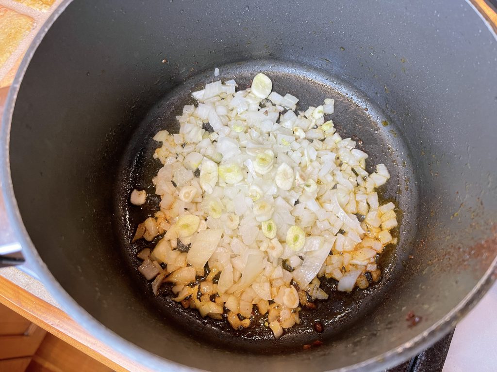 place onion and garlic in the same pot