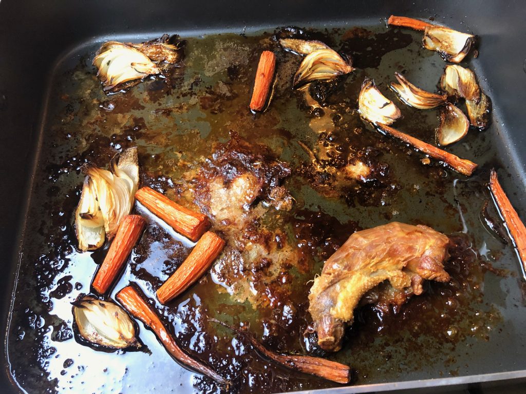 remove the turkey from the pan and defat the drippings