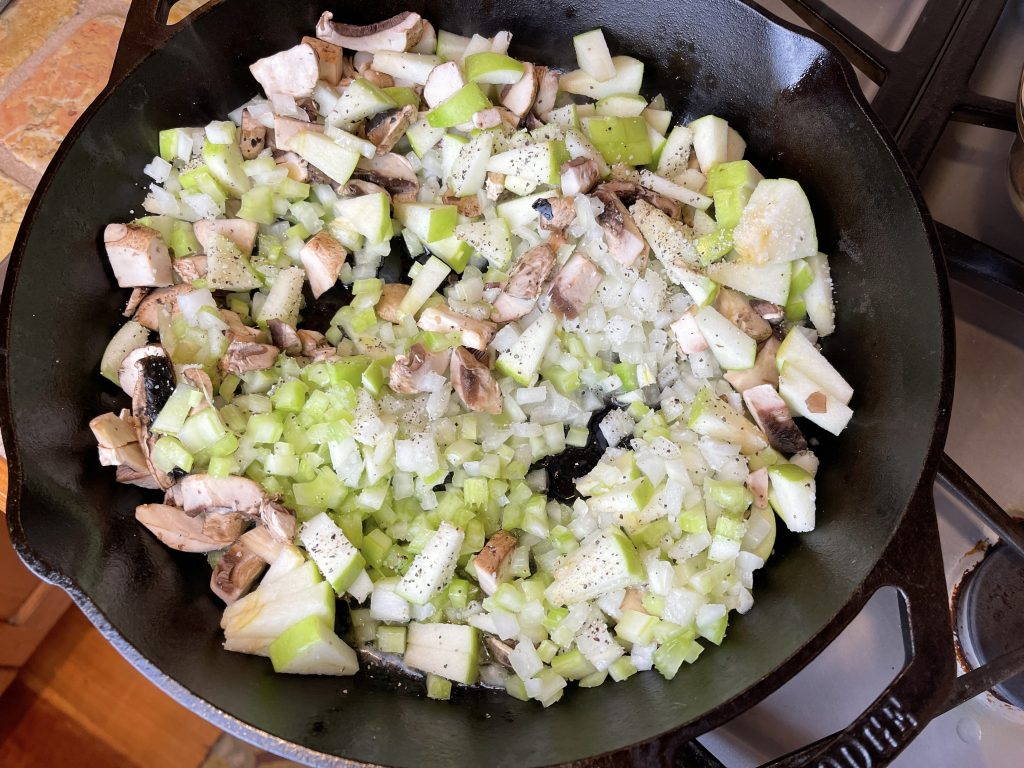 add apples, onions, celery and mushrooms to the pan.