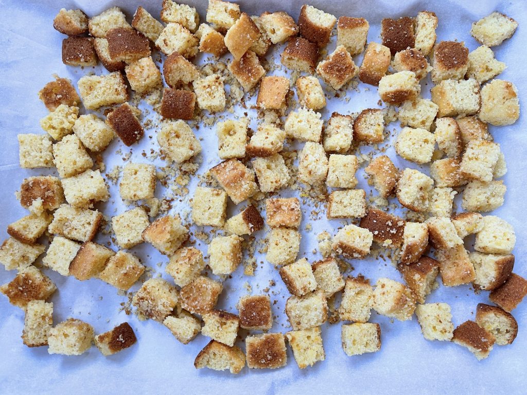 place gluten free cornbread cubes on a foil or parchment-lined baking sheet.