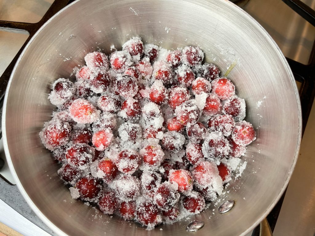 Stir cranberries and sugar together
