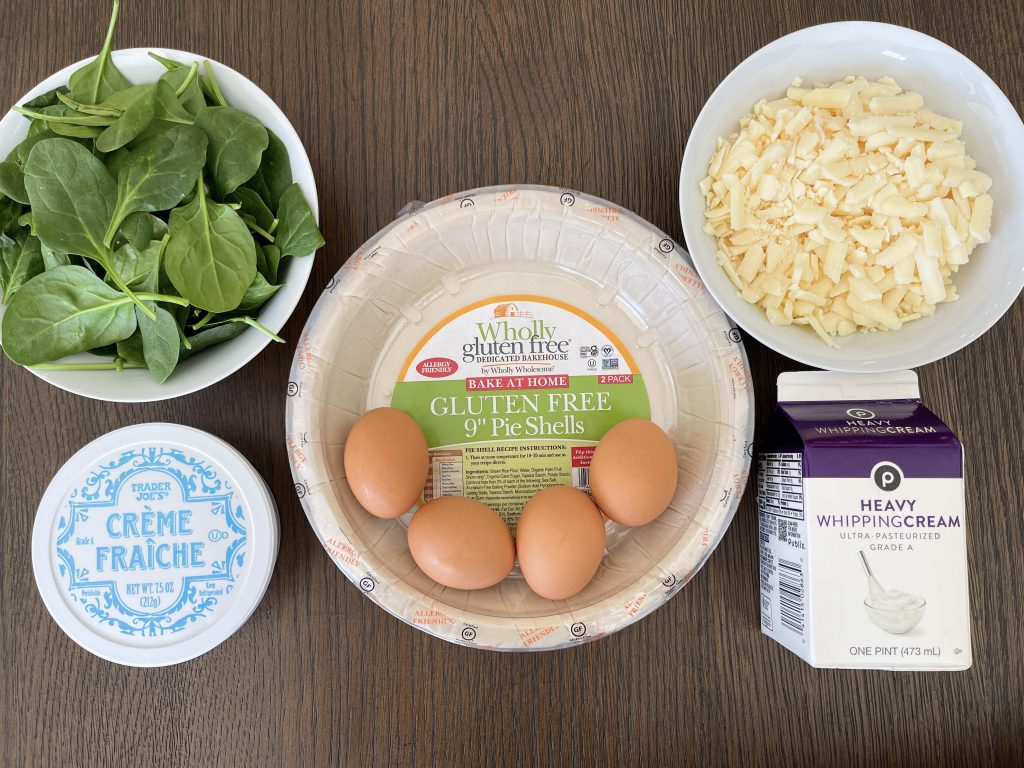 Ingredients for the Tart - gluten free pie crust, eggs, heavy whipping cream, creme fraiche, cheddar cheese, and baby spinach