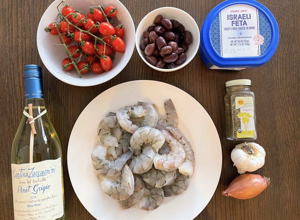 ingredients for Mediterranean Shrimp - raw shrimp, cherry tomatoes, garlic, shallot, oregano, white wine, feta, and kalamata olives