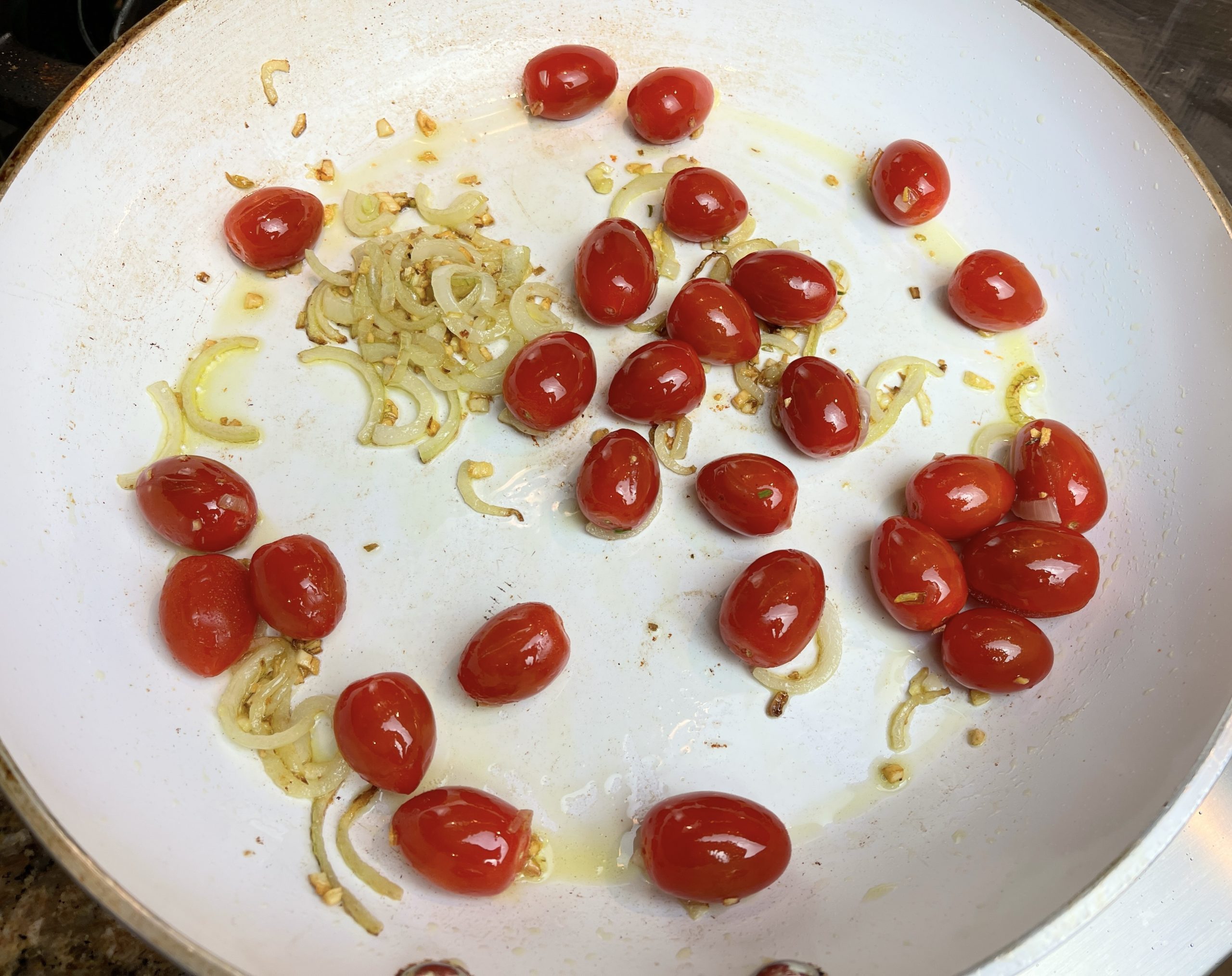 add the cherry tomatoes to the pan