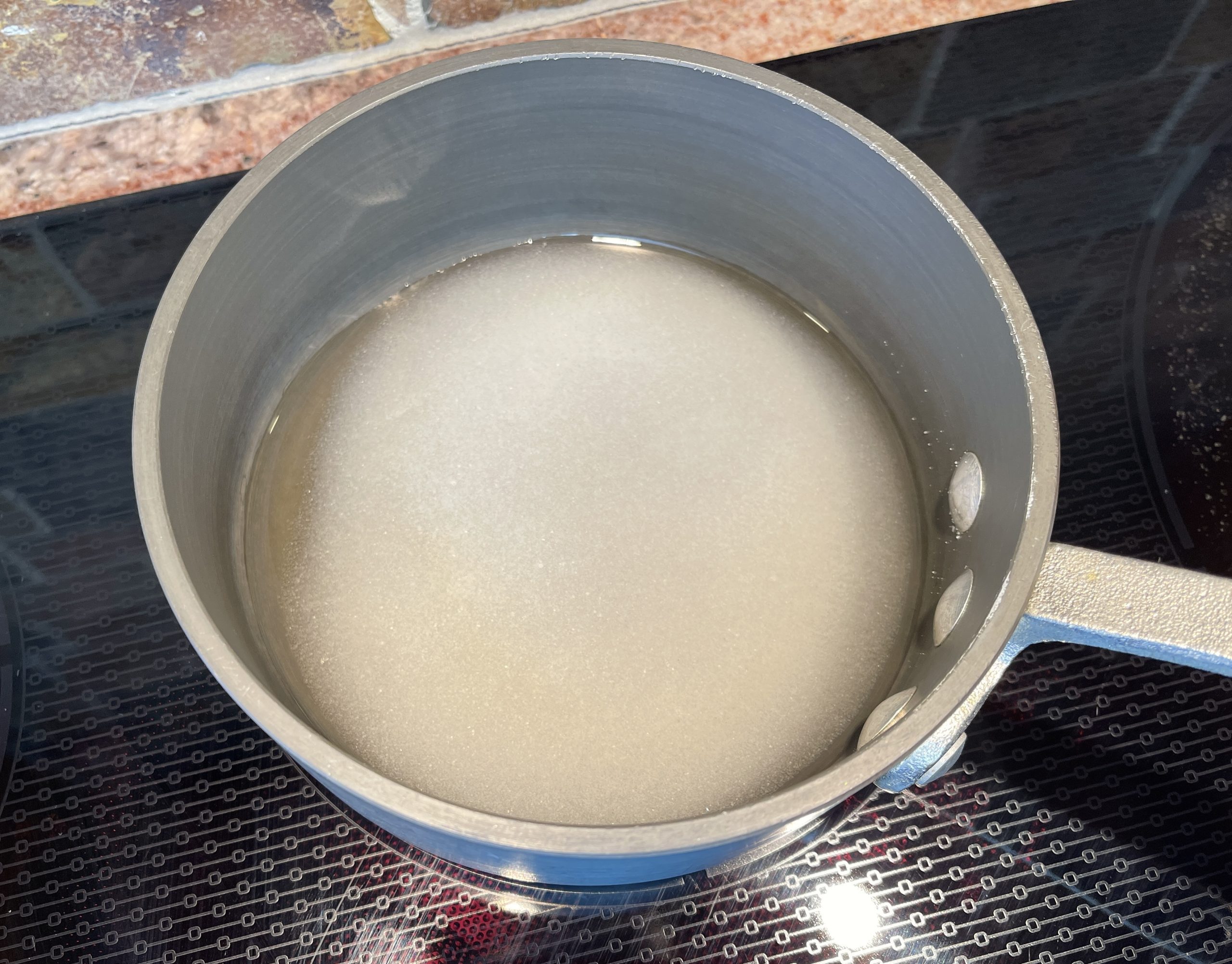 Combine sugar and water in a small saucepan