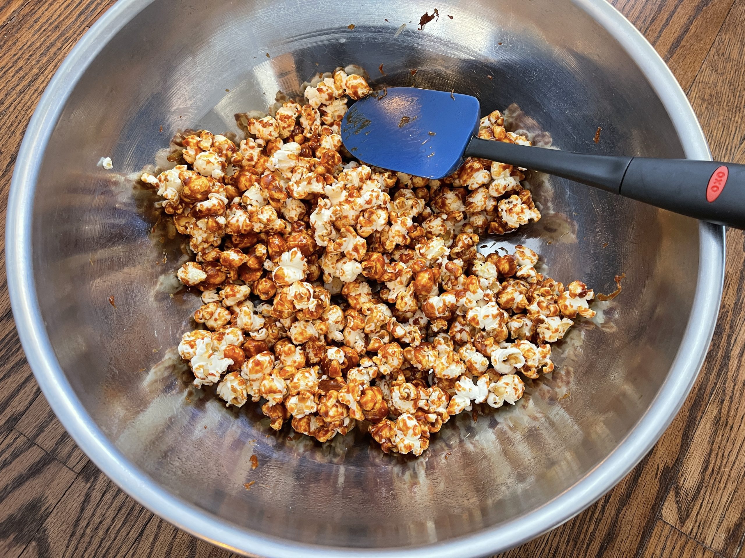 Mix popcorn and sauce until popcorn is coated