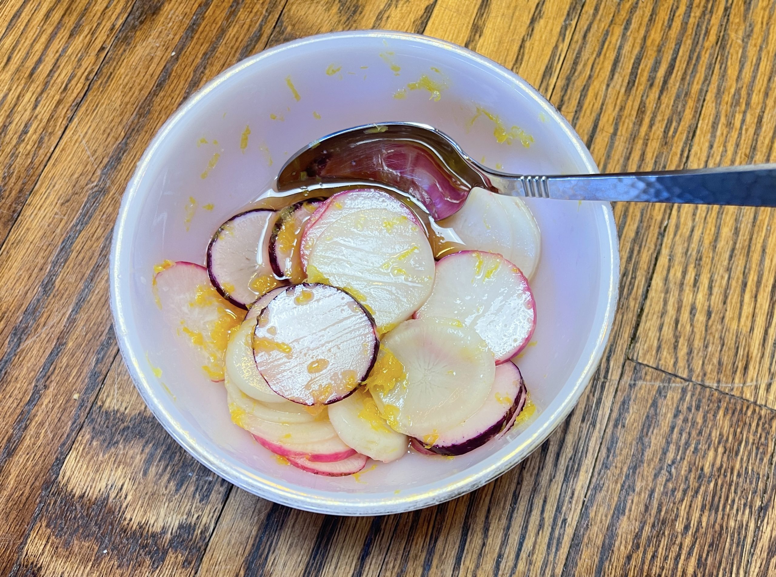 Toss radishes, lemon zest and juice, and salt in a small bowl. Set aside.