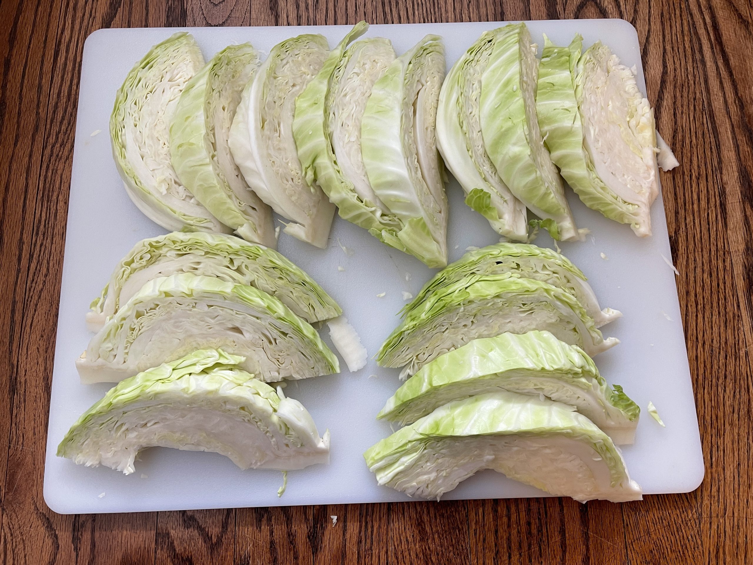 cut cabbage in quarters, and then cut each quarter into approx. thirds trying to make each wedge no more than 1 1/2" thick