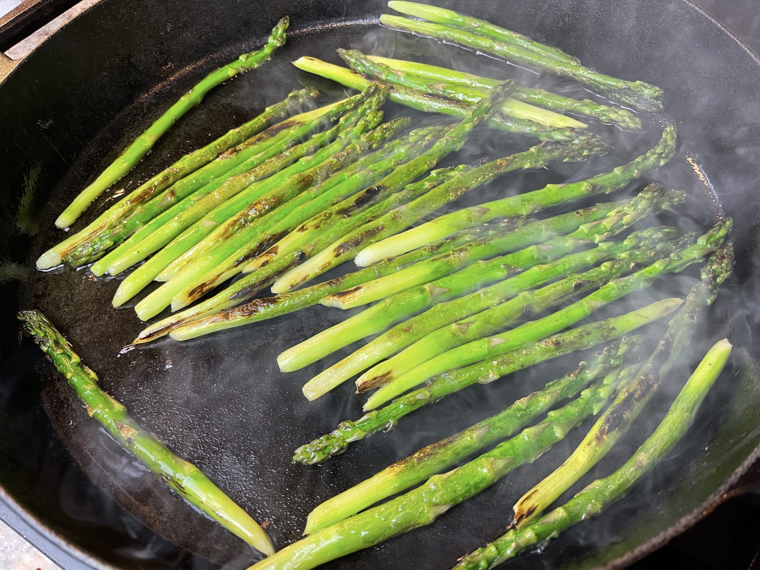 Use tongs to turn asparagus and cook an additional 3 minutes until asparagus are crisp-tender and charred in spots, about 5 minutes total. Sprinkle asparagus with black pepper, red pepper flakes, and season with salt. Transfer asparagus to a platter.