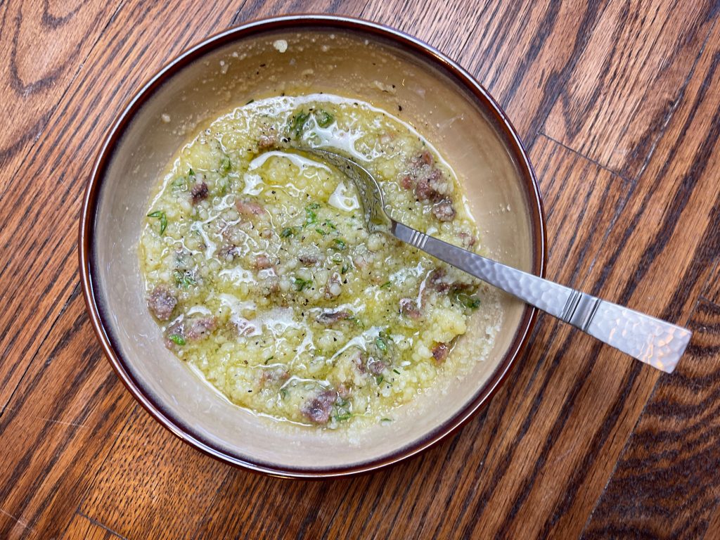 combine parmesan, anchovies, garlic, thyme, and pepper together.