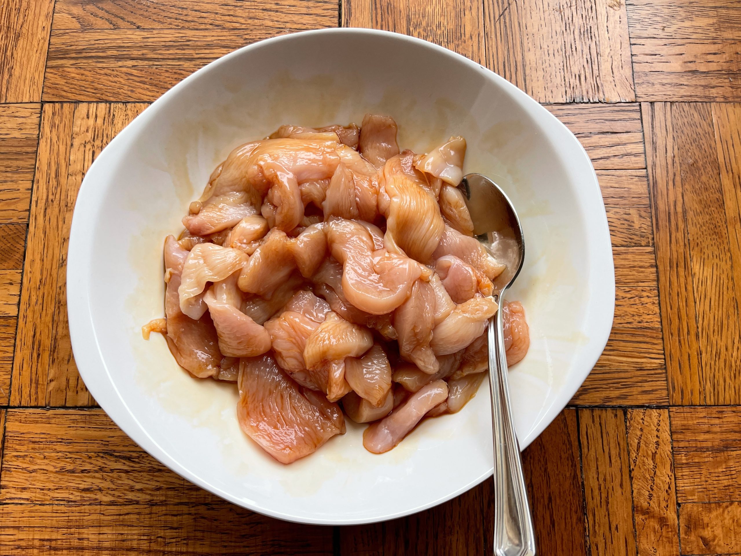 Combine thinly sliced chicken in a medium size bowl with one tablespoon gf soy sauce
