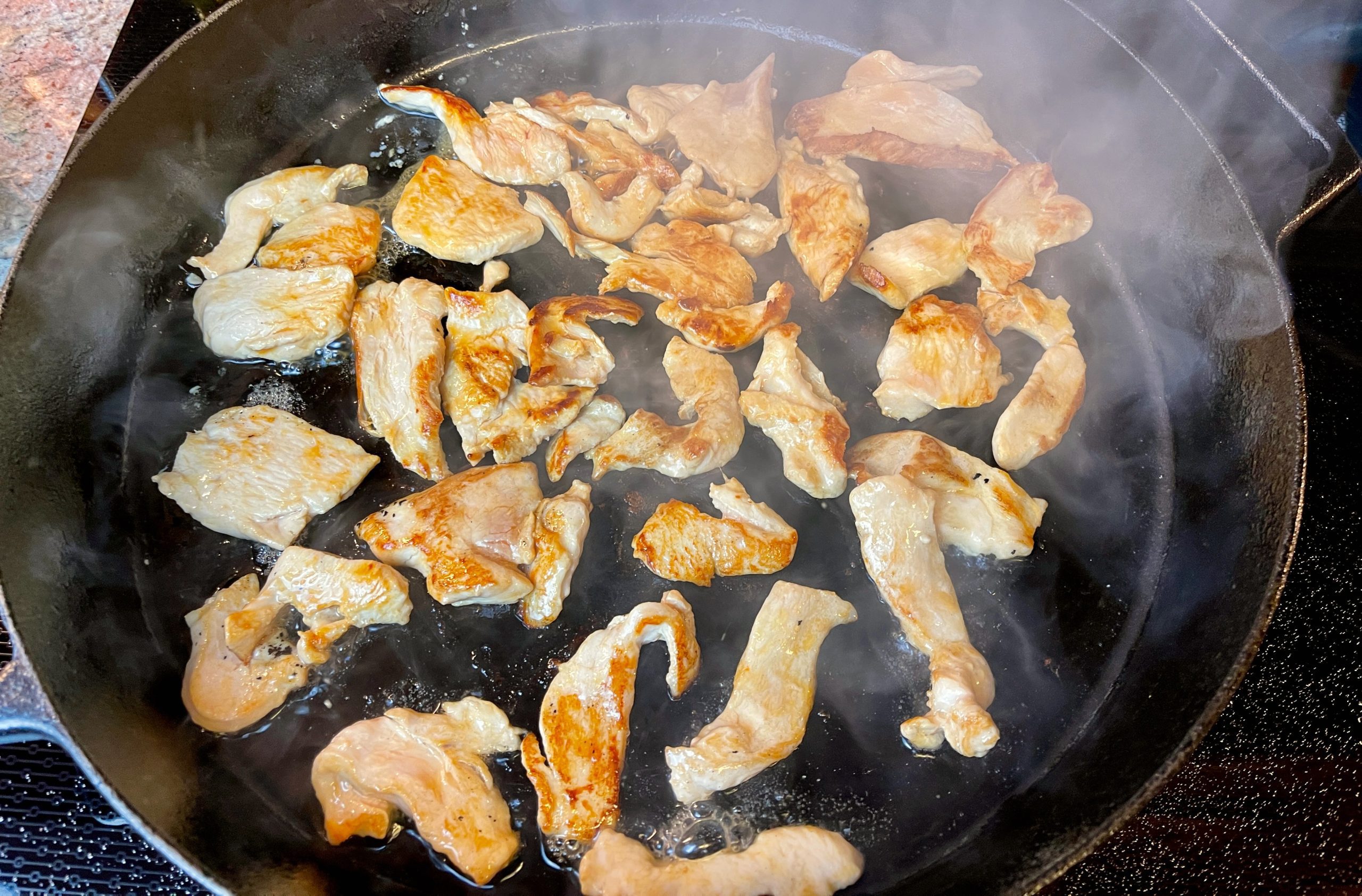 Turn chicken slices over and cook for an additional 1 minute.