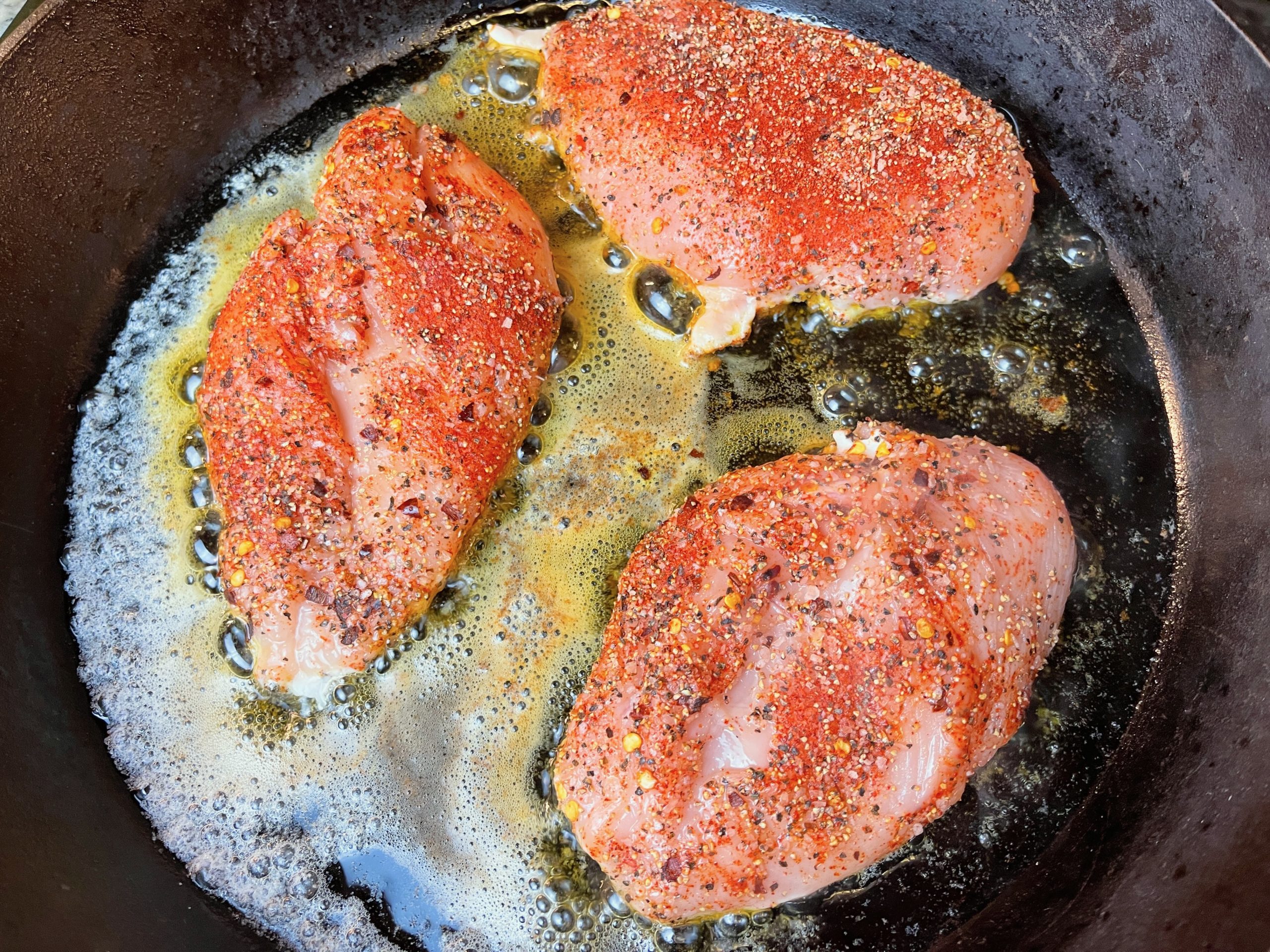 place chicken breasts in heated pan for 4-5 mins, until browned on one side