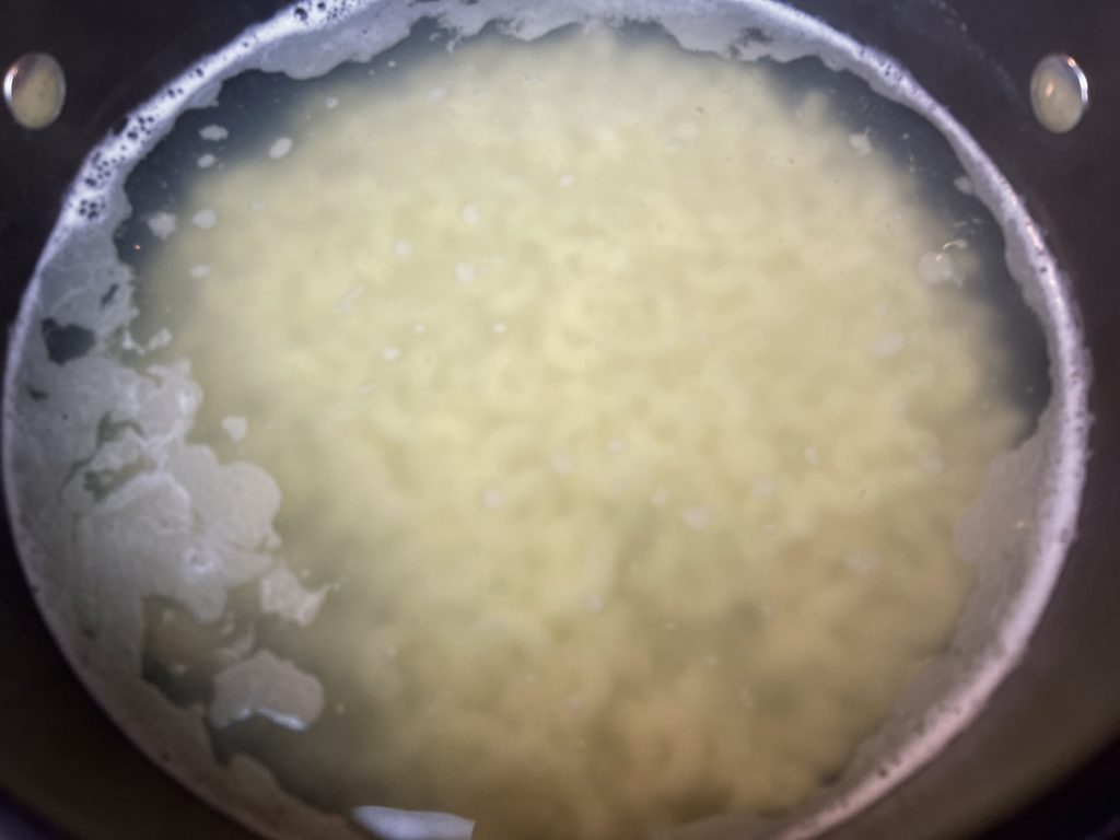 Cook the elbow macaroni in boiling water for 6 mins and then drain and let cool slightly