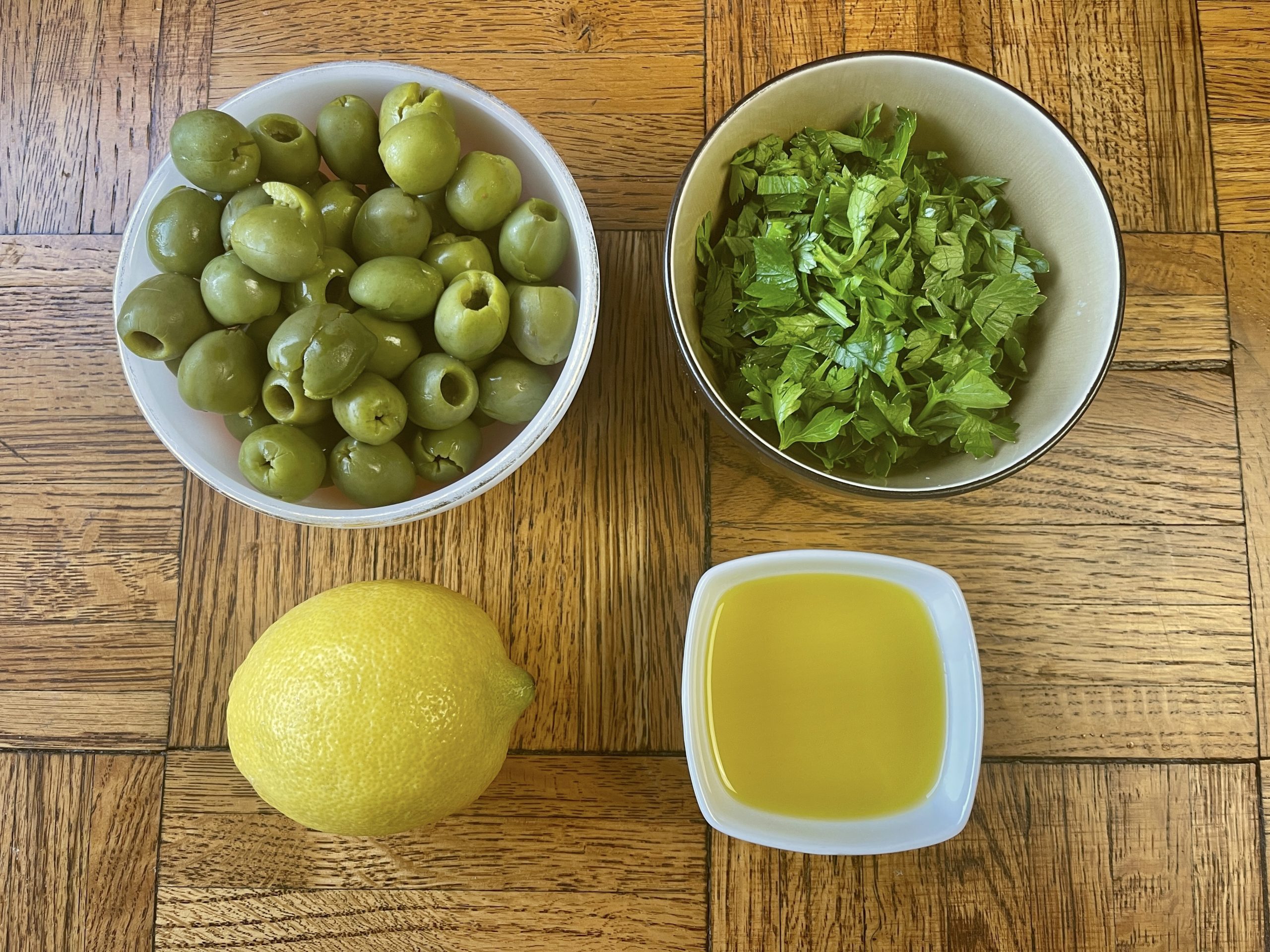 olive herb dressing ingredients - castelvetrano olives, parsley, lemon and olive oil
