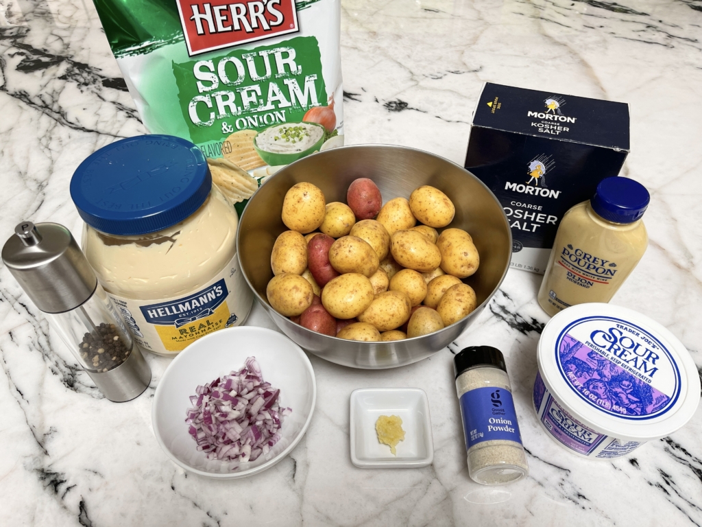 organize ingredients - Sour cream & onion potato chips, baby potatoes, mayo, mustard, sour cream, onion powder, garlic, onion, kosher salt and pepper