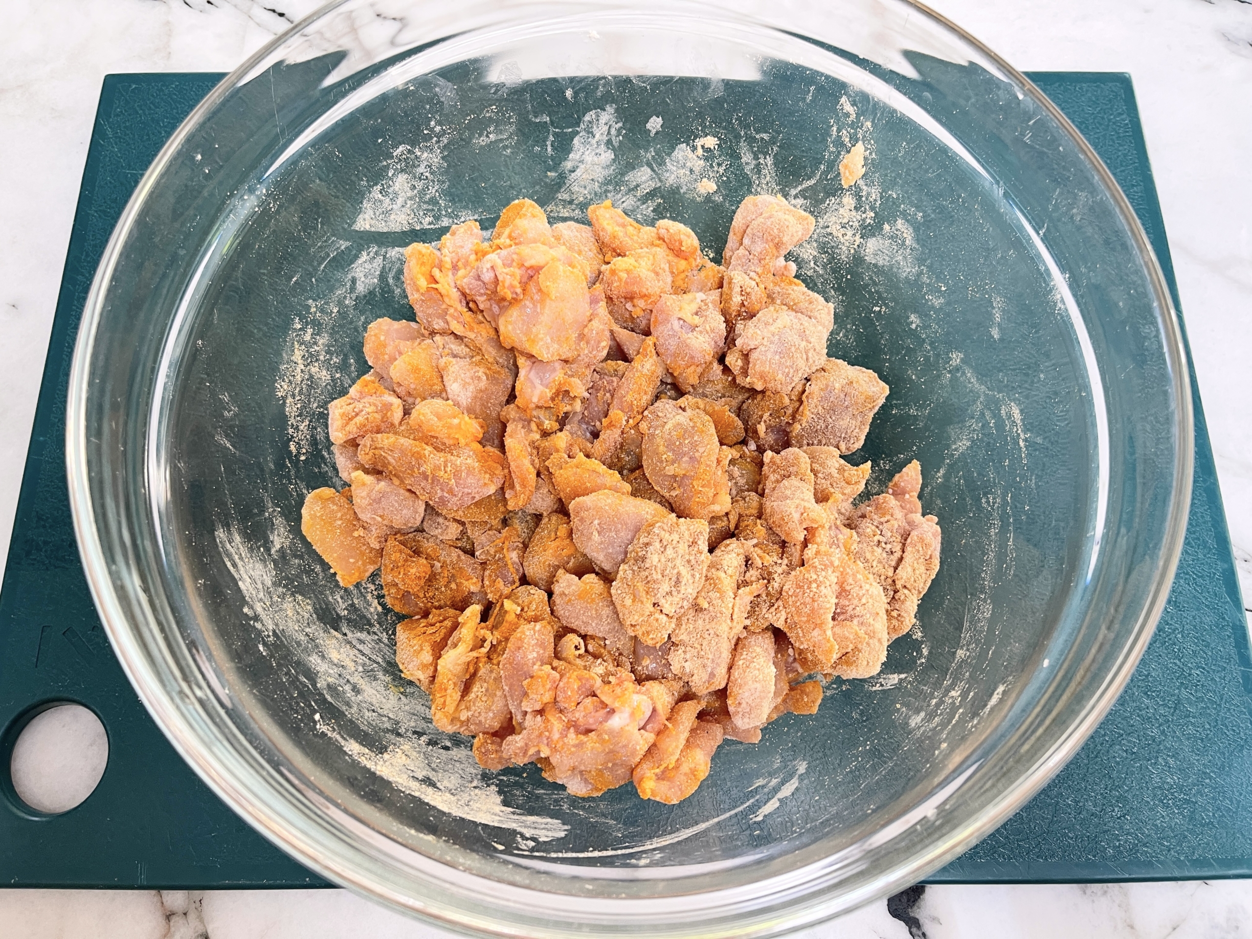 thoroughly combine the turmeric, gf flour and salt with the chicken