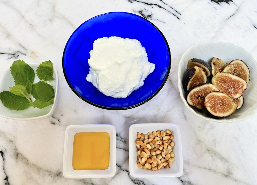 organize ingredients - yogurt, fresh figs, toasted pine nuts, honey, and fresh mint