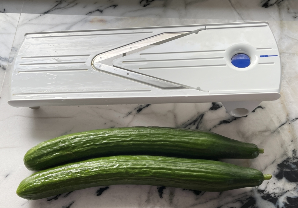 the easiest way to thinly slice the cucumbers is to use a mandolin