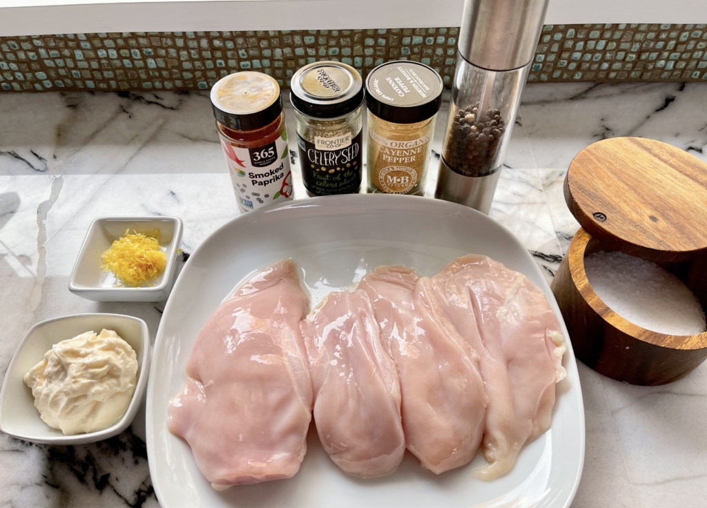 ingredients - chicken breasts, mayo, lemon zest, paprika, celery seeds, kosher salt, pepper, and cayenne pepper