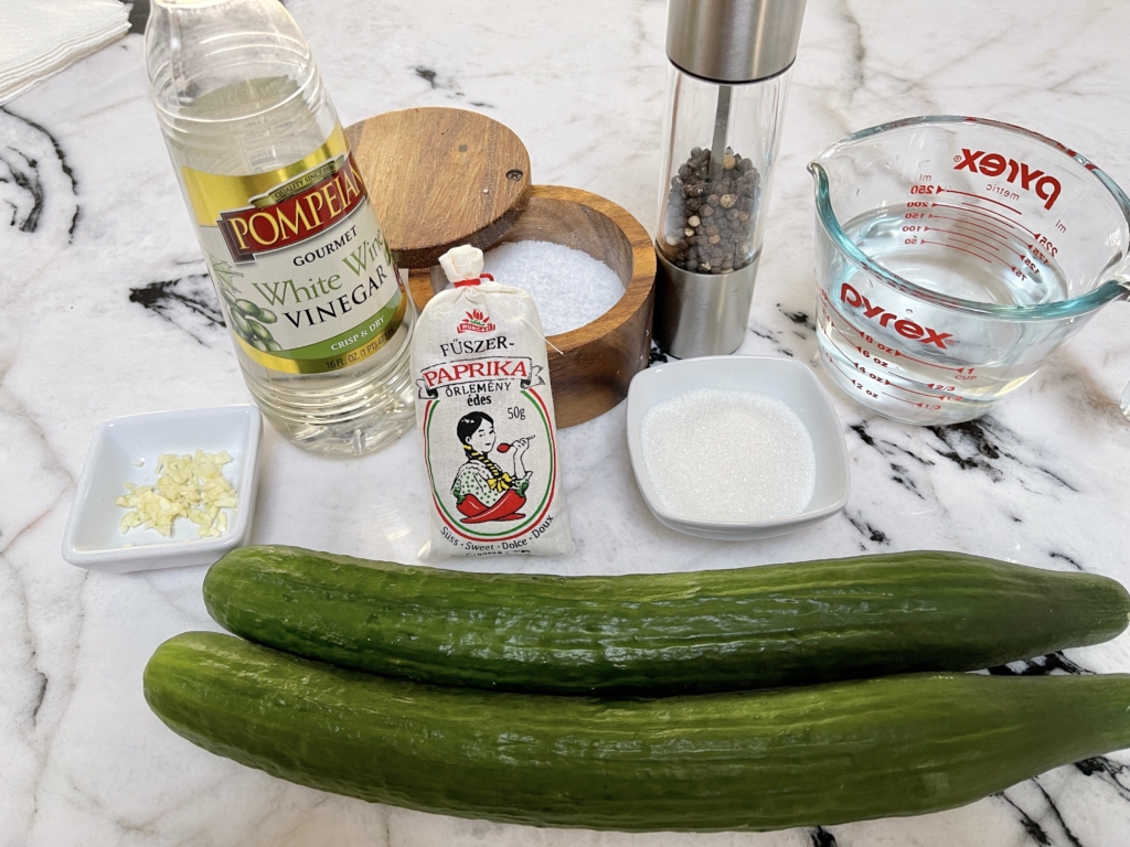 Ingredients - English or Persian cucumbers, garlic, white vinegar, sugar, kosher salt, water, pepper, and paprika