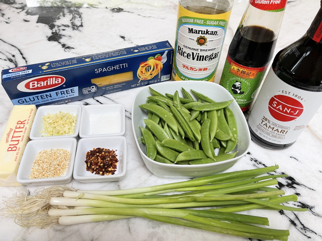 Ingredients - gf pasta, scallions, gf oyster sauce, gf soy sauce, rice vinegar, sugar, unsalted butter, garlic, snow peas and, hot pepper flakes