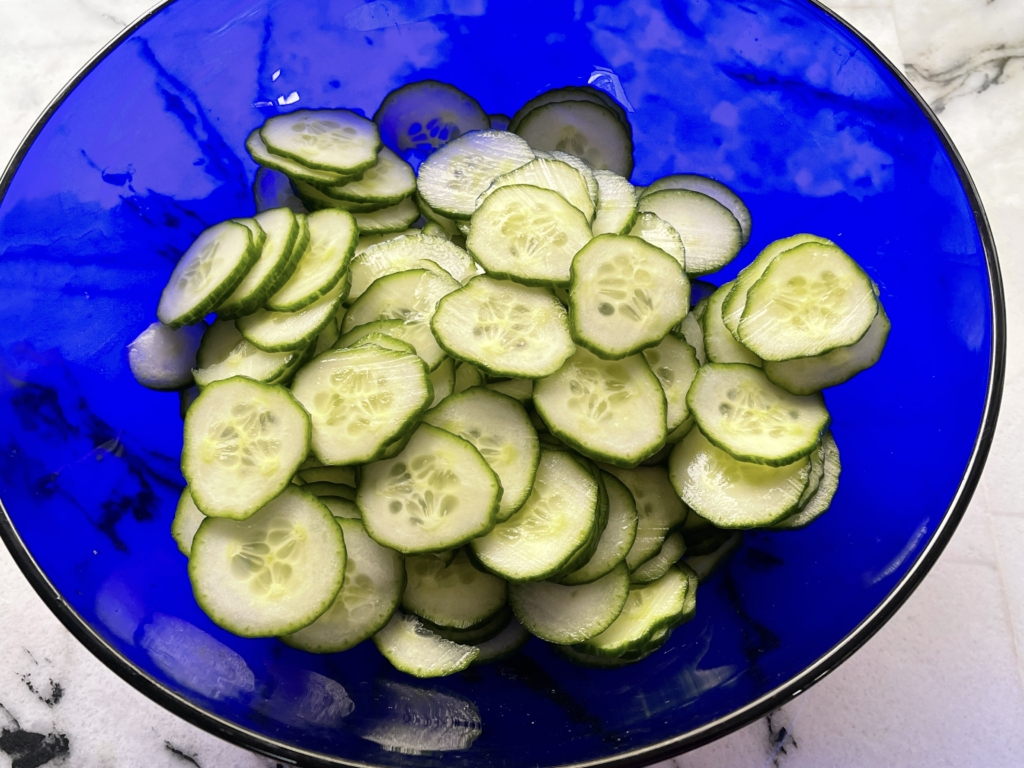 slice cucumbers and place in a large bowls