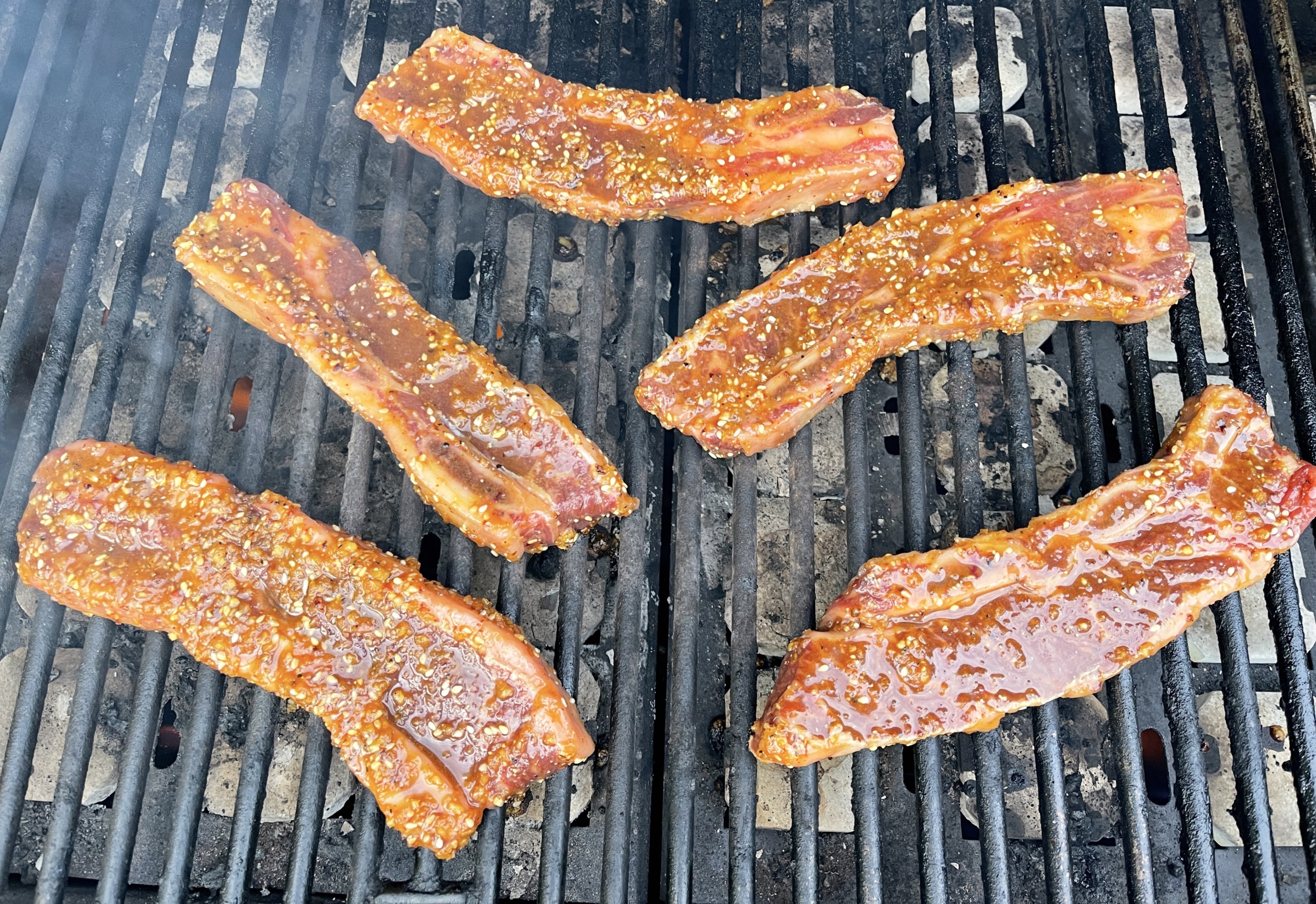 Place short ribs on an oiled grill over medium high heat