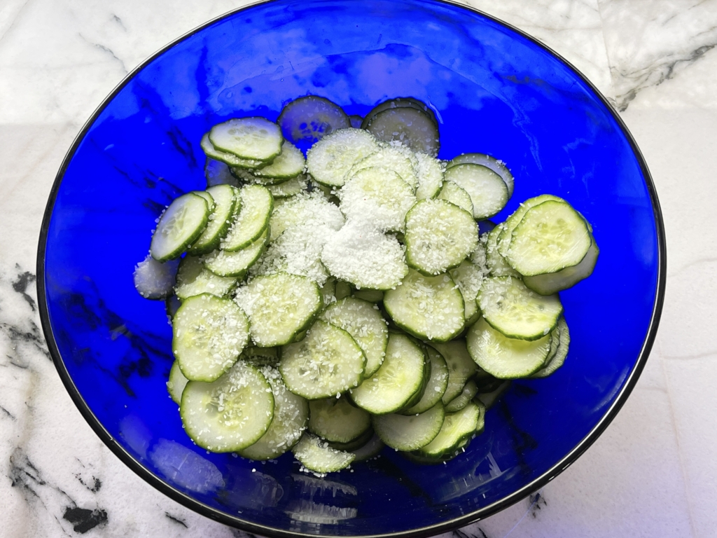 mix kosher salt and cucumber slices together and let sit 15 mins