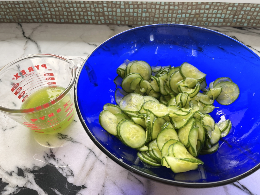 squeeze handfuls of cucumbers to remove as much additional liquid as possible