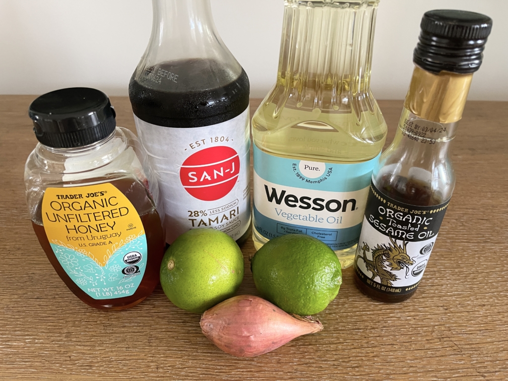 ingredients for sesame lime sauce - sesame oil, lime juice, shallots, neutral oil, gf soy and honey