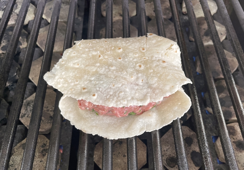 place lamb pocket on the grill.  cook for 5-6 minutes on first side.