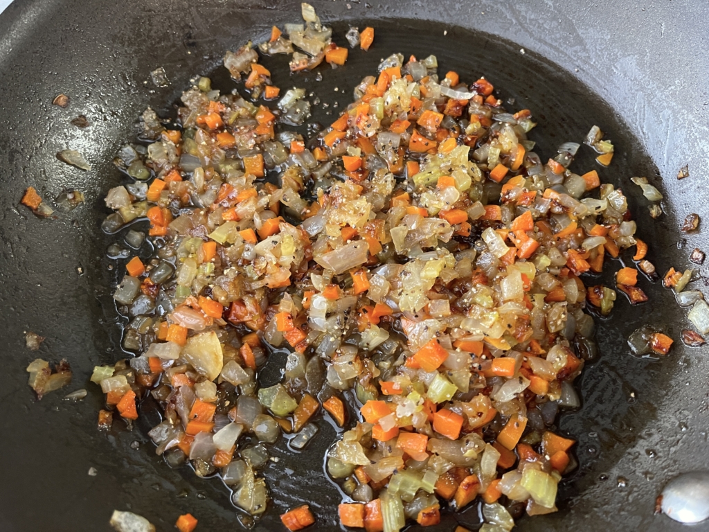 Once veggies have softened, remove pan from heat and add worcestershire, cider vinegar, allspice/cinnamon and season with salt and pepper