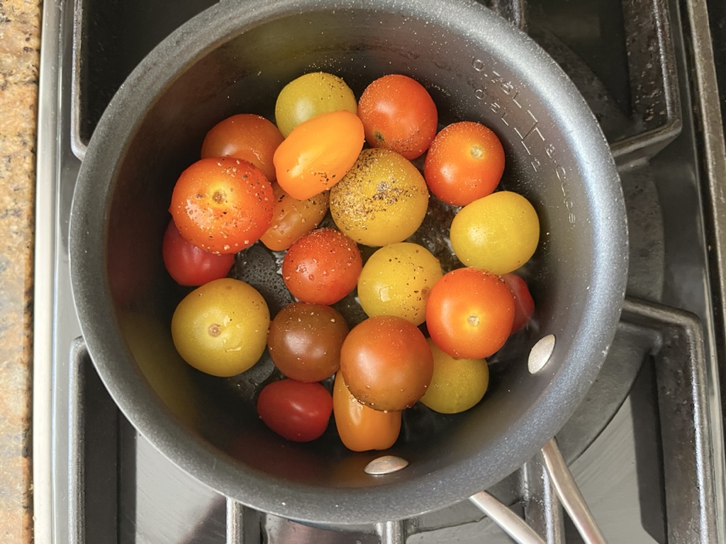 place cherry tomatoes  in a small saucepan with gluten free soy sauce, olive oil, and black pepper 
