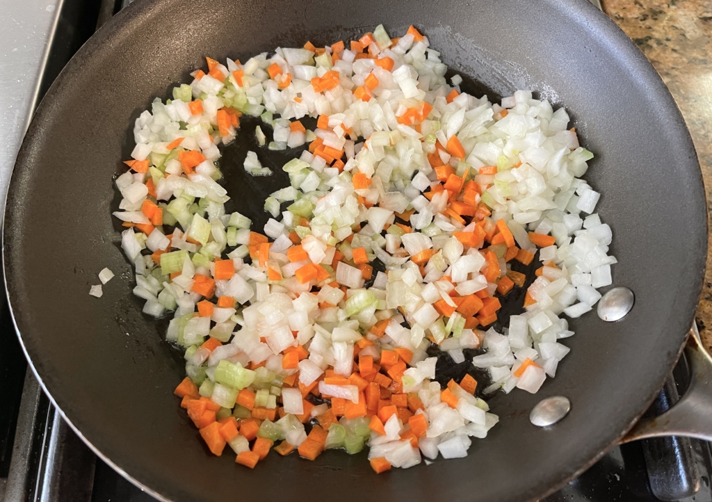 place carrots, onions, garlic and celery in a large pan over medium heat
