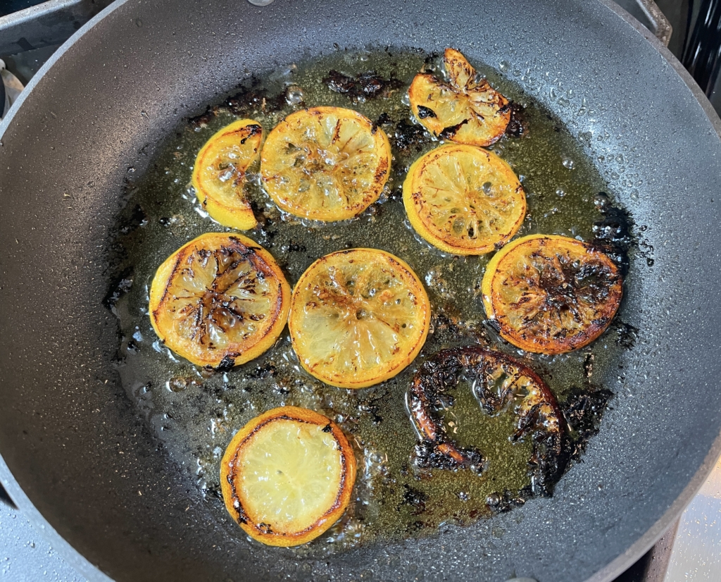 cook lemon slices for approx 8 minutes, 5-6 mins on the first side and 1-2 mins on the next side. cook lemons until they are browned and caramelized