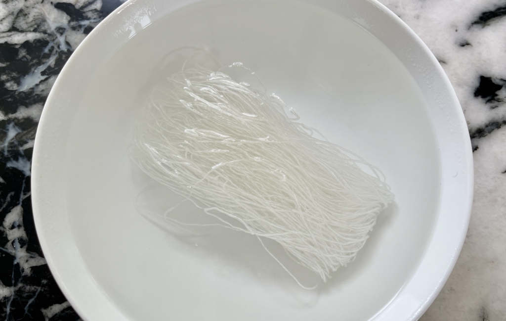soak noodles in boiling hot water for 1-2 minutes