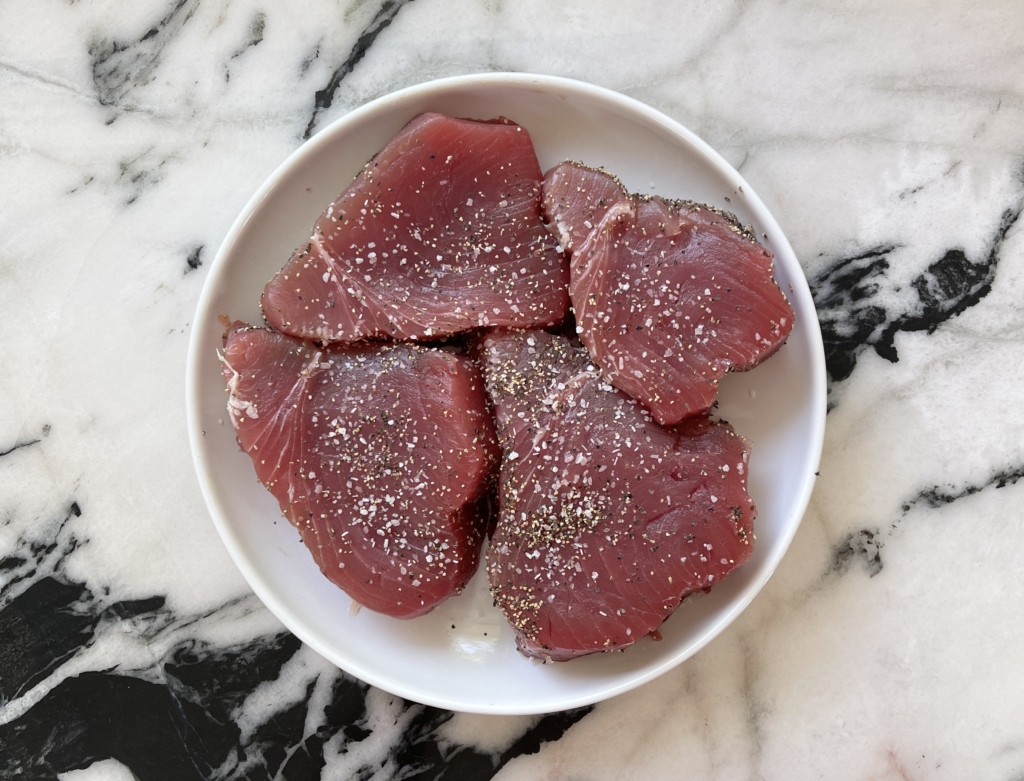 Season tuna generously with salt and pepper. 