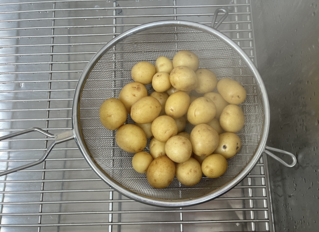 Drain the potatoes in a colander