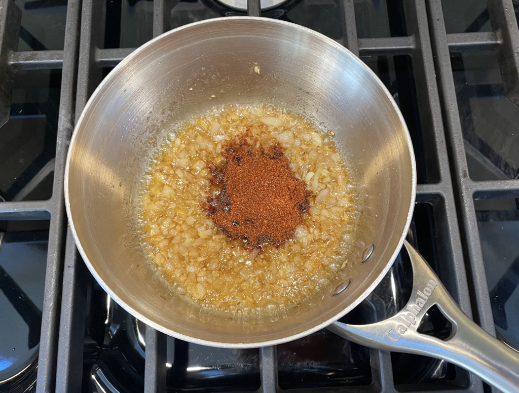 Add remaining 1 tablespoon bbq seasoning and continue to cook, stirring, until fragrant, about 30 seconds.