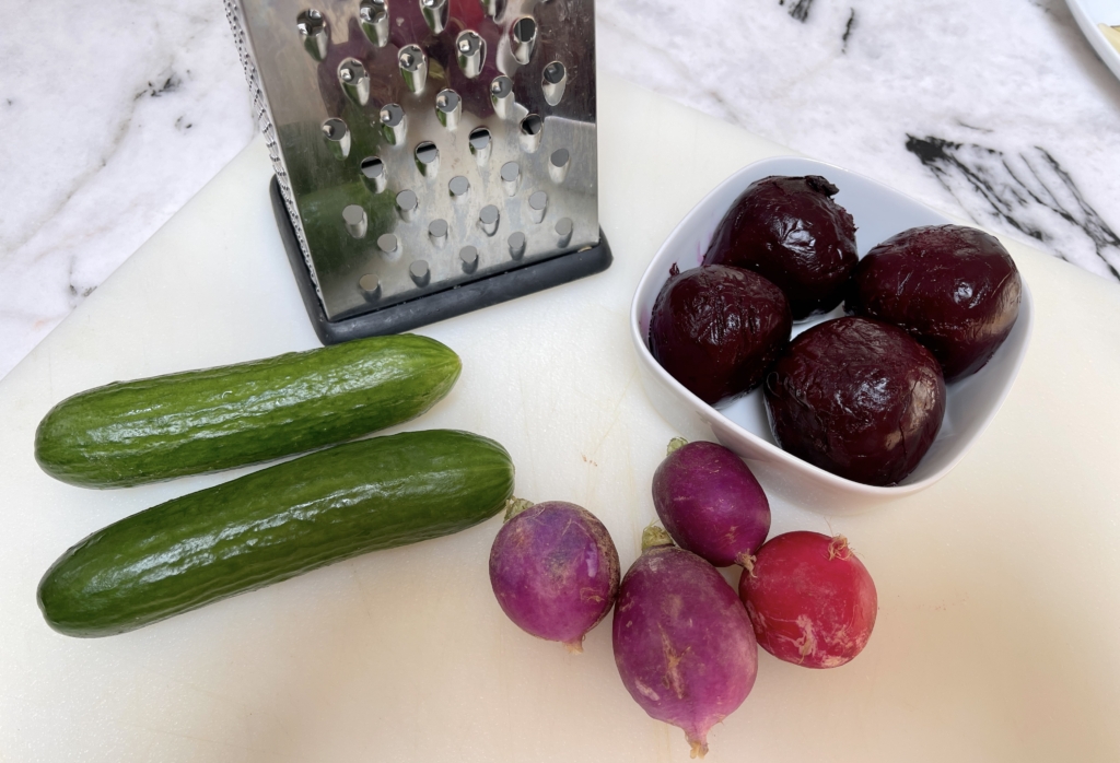 grate radishes, cucumbers and roasted beets using the large hole side of the grater.