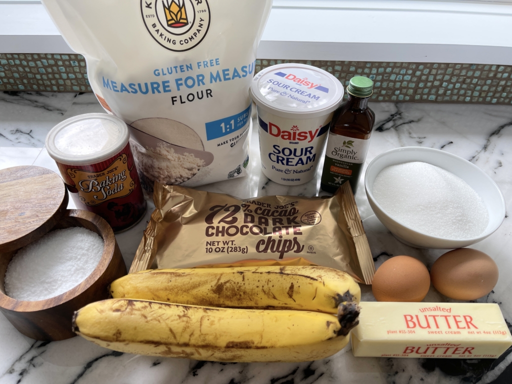 Ingredients - ripe bananas, chocolate chips, butter, eggs, sour cream, sugar, kosher salt, baking soda, vanilla and King Arthur's Measure for Measure Gluten Free Flour