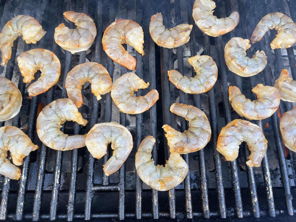 Cook the shrimp on the preheated grill over medium high heat for 2 minutes.