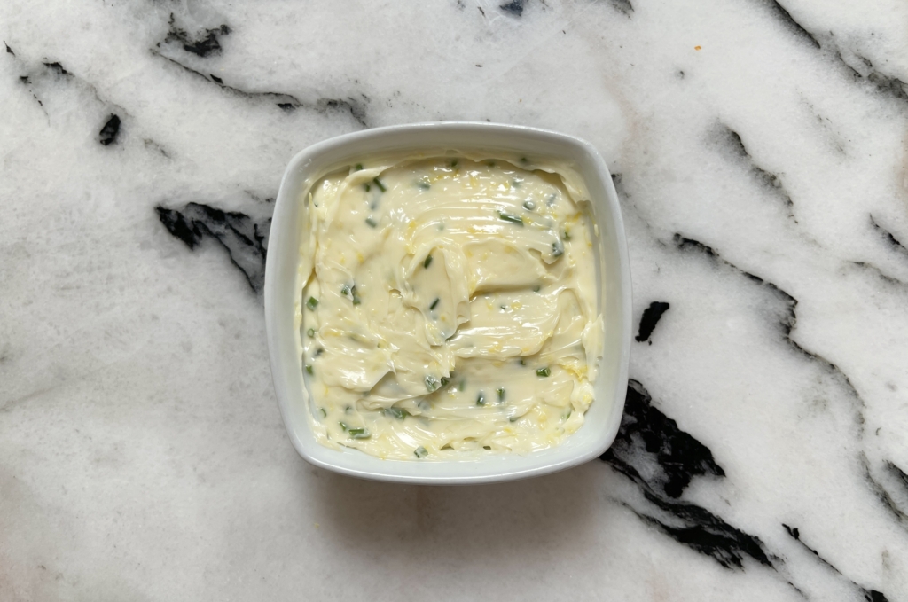 Place Lemony Chive Butter in a small ramekin. Cover with plastic wrap and chill until ready to use