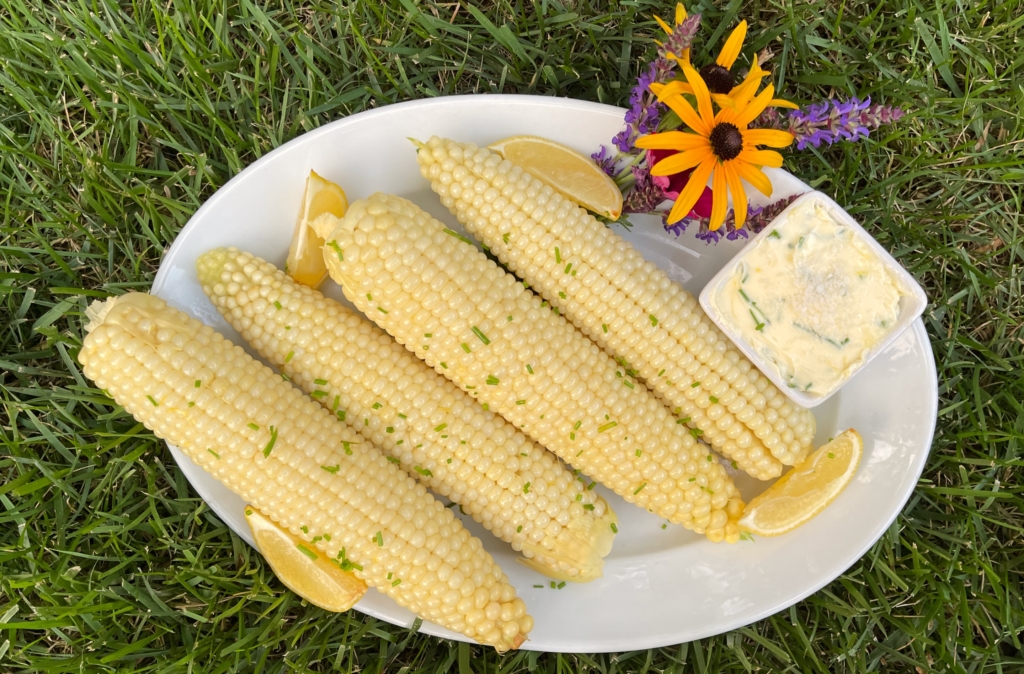 Place corn on a platter and serve with Lemony Chive Butter. Sprinkle Flaky Sea Salt or Kosher Salt on the Butter and serve.