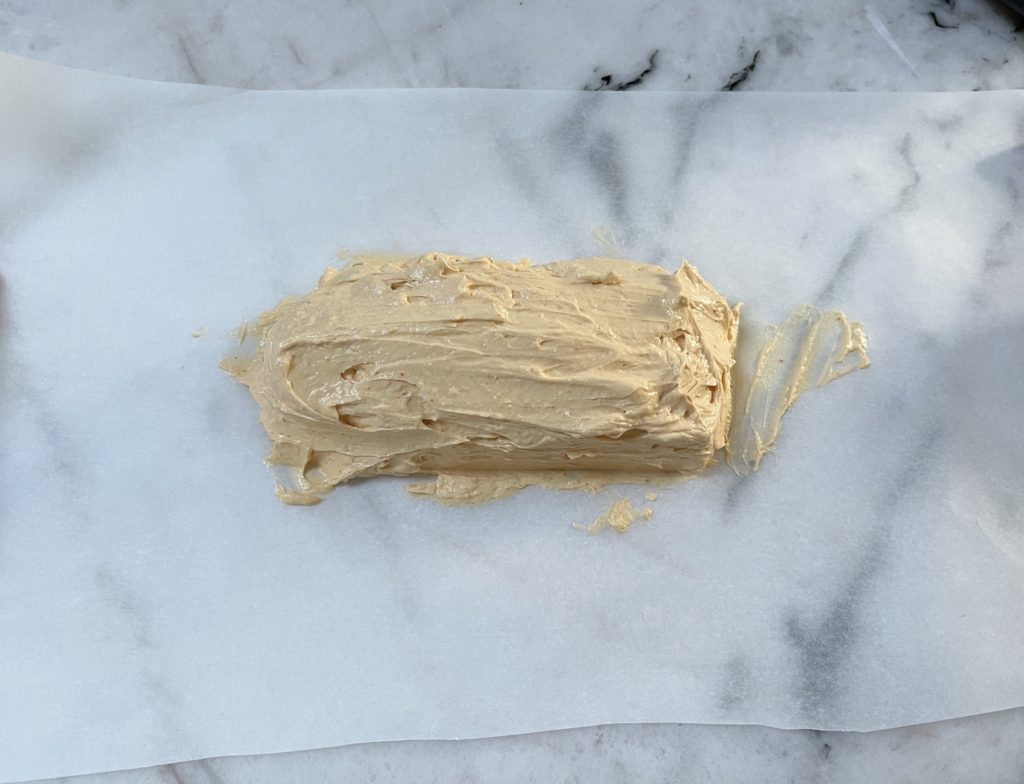 Remove butter with a rubber spatula and place onto a piece of parchment paper (you’ll most likely need to cut the paper down once the butter is on it). 