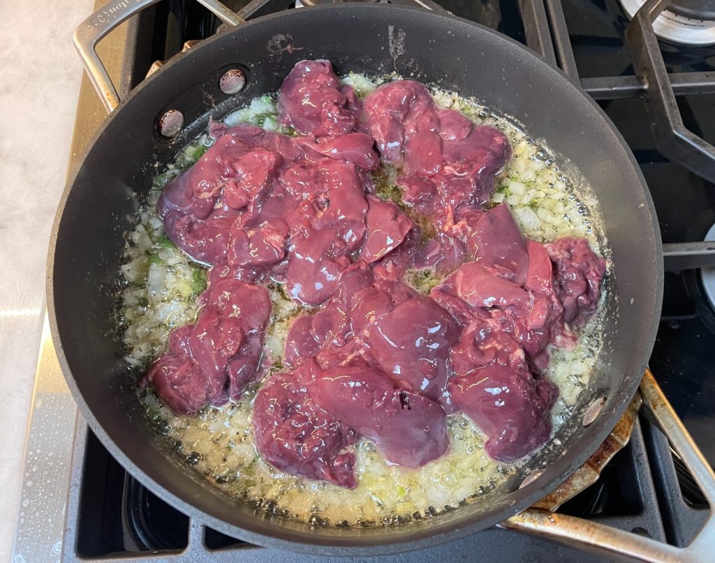 Add chicken livers to the pan.